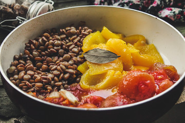  Lentils with vegetables in a tomato sauce in a frying pan