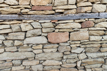 Fototapeta premium Stone wall texture with timbers