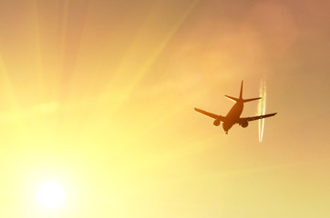 Aircraft, one high, another low sky at sunset sun