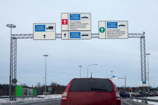 Cars Stand Long Queue For Passing Red And Green Corridors  On Of Borderline Checkpoint. Border Crossing Point Nuijamaa Between Finland And Russia