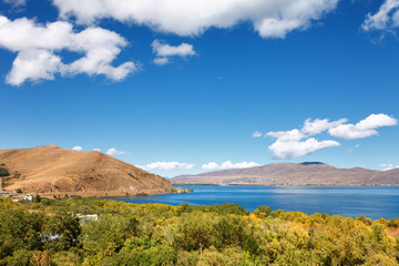 Sevan lake and white clouds blue sky on a sunny day, Armenia