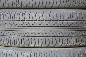 The background of the tread pattern of the car wheel. Rubber tir