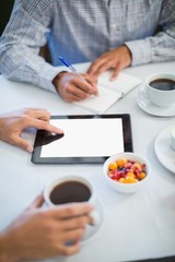 Executives using digital tablet