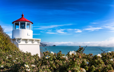 Fototapeta na wymiar Small Lighthouse Guarding the Bay