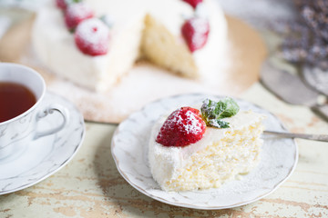 beautiful cake with strawberries and cream