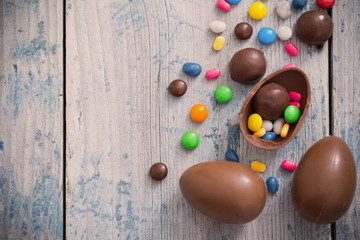 Chocolate Easter Eggs Over Wooden Background