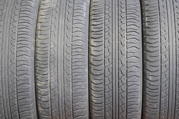 The background of the tread pattern of the car wheel. Rubber tir