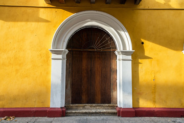 Door and Yellow Building