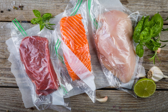 Beef, chicken and salmon in vacuum plastic bag for sous vide cooking