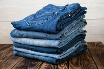 jeans pile on wooden board