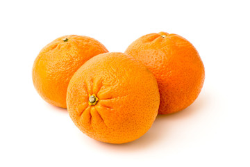Three tangerine on a white