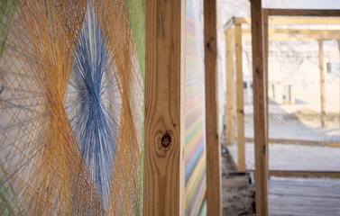 String art from threads on a wooden wall