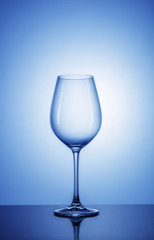 Wine glass on color background