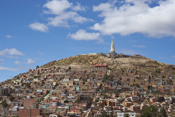 Statue of Christ the Redeemer on a high overlooking the mining town of Oruro on the altiplano of Bolivia. 