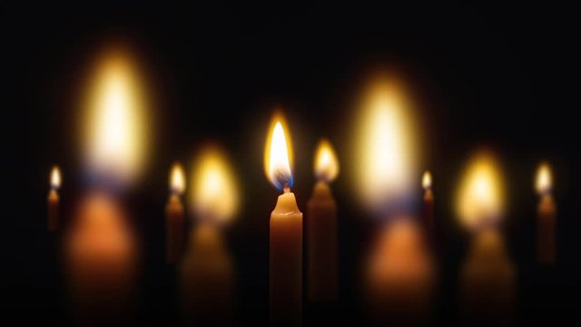group of candle light on black background