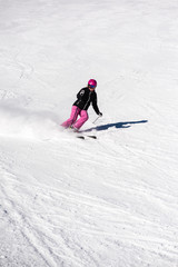 Fototapeta na wymiar Female skier in fresh powder snow