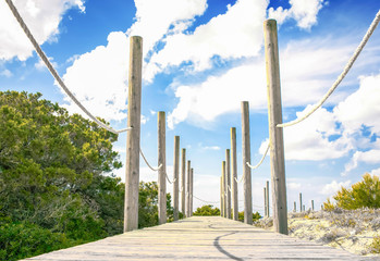 Fototapeta premium Beach jetty at beach in Santo Tomas, Menorca, Spain