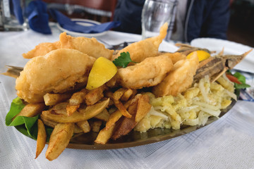 Fish barbeque plate in carda, small fish restaurants on the Danube river in Serbia