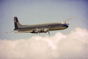 Classic airliner above the clouds