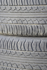 The background of the tread pattern of the car wheel. Rubber tir
