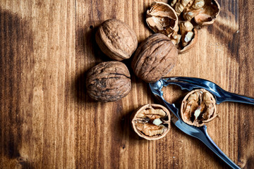 Walnuts and cracker on wooden table