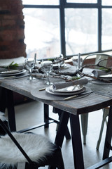 Table setting on a table of natural wood