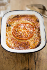 Lamb moussaka with slice of tomato 
