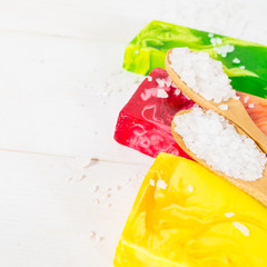 Color soap and two spoons with sea salt