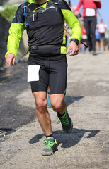 Fototapeta premium Runner with sportswear running fast during the race