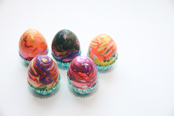 The abstract Easter eggs in muffin cups