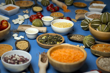 Various dried legumes in bowls for background, Raw legume on old rustic wooden table, Healthy protein food,