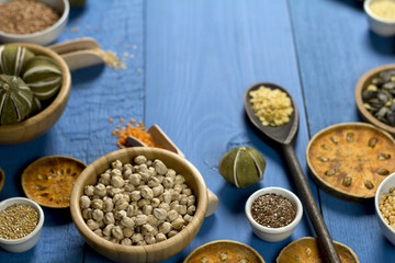 Various dried legumes in bowls for background, Raw legume on old rustic wooden table, Healthy protein food. Place for typography, top view