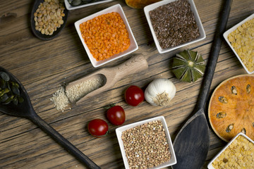 Various dried legumes in bowls for background, Raw legume on old rustic wooden table, Healthy...