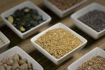 Various dried legumes in bowls for background, Raw legume on old rustic wooden table, Healthy protein food.