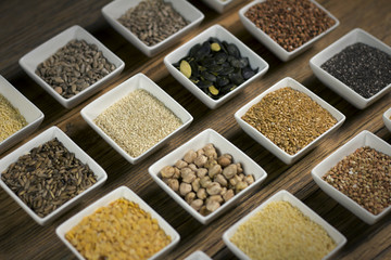 Various dried legumes in bowls for background, Raw legume on old rustic wooden table, Healthy protein food.