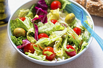 Salad with tomatoes, olives carrots