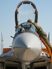 Servicing a fighter jet aircraft