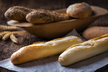 Freshly baked white and brown baguette