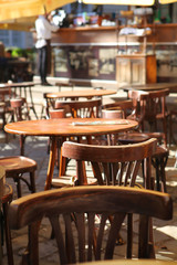 empty little tables of cafeteria