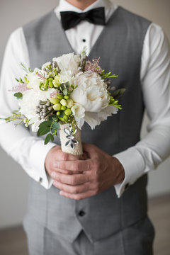 Bridegroom Holding A Bouquet