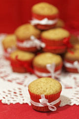Homemade cupcakes on a red background. Festive bakery
