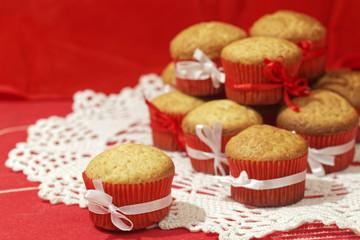 Homemade cupcakes on a red background. Festive bakery