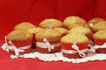 Homemade cupcakes on a red background. Festive bakery