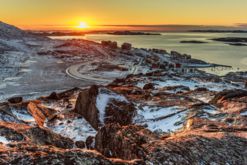 Beautiful Polar sunset, view from the hill to Nuuk fjord and new suburb of city, Greenland © vadim.nefedov