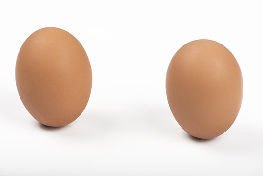 Two brown eggs on white background. Isolated.