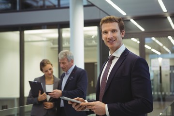 Businessman using digital tablet at office