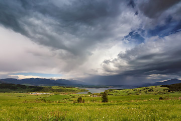 Spring rain and storm in mountains. Green spring hills of Slovakia