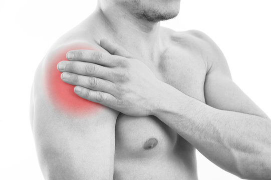 Man with shoulder pain over white background