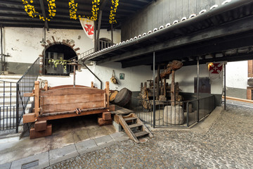Fototapeta premium The museum - storage of expensive vintage wine Madeira. An ancient press for a grapes extraction