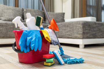 Cleaning service. Bucket with sponges, chemicals bottles and mopping stick. Rubber gloves and towel. Household equipment.